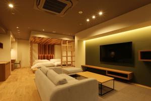 Un televizor și/sau centru de divertisment la Shoenso Hozugawatei