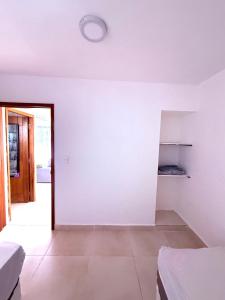 Ένα ή περισσότερα κρεβάτια σε δωμάτιο στο Paradisio Rentals