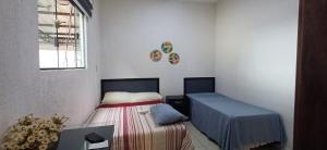 En eller flere senge i et værelse på Del este