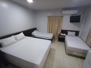 En eller flere senge i et værelse på Del este