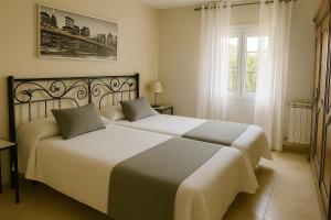 Postel nebo postele na pokoji v ubytování Apartamentos casa Carola