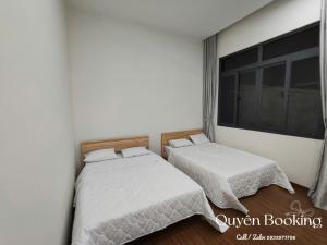 Ένα ή περισσότερα κρεβάτια σε δωμάτιο στο Tố Quyên Homestay PT