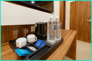 a counter with two bottles of water on a counter top at Hotel Shri RK Residency Near Kashi Vishwanath Temple - Fully Air Conditioning Rooms - Restaurant-Lift and Free Wifi Facilities- Top Rated Hotel In Varanasi in Kashi