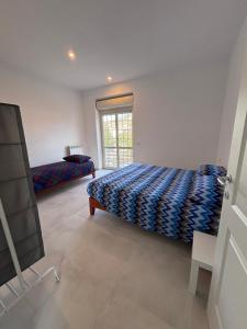 Ένα ή περισσότερα κρεβάτια σε δωμάτιο στο Anima Domus