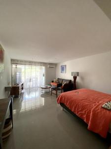 Postel nebo postele na pokoji v ubytování Appart Flamboyant 1006