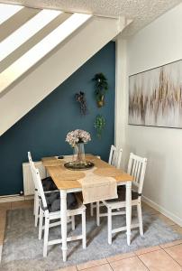 a dining room with a wooden table and chairs at Quiet townhouse in Cork in Cork +12 photos