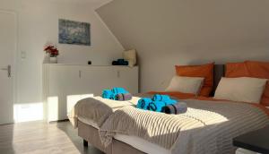 Ένα ή περισσότερα κρεβάτια σε δωμάτιο στο Ferienhaus Hörnchen