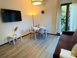a living room with a table and a couch at Teps home Airport Venice in Venice