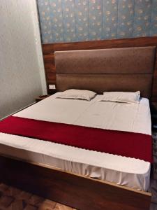 Postel nebo postele na pokoji v ubytování Hotel Madhuban Hills