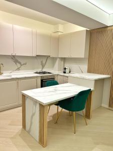 Kuchyň nebo kuchyňský kout v ubytování Apartment in Cortina North