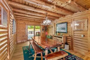 a dining room with a wooden table and chairs at Sugar Bear Lodge in Banner Elk