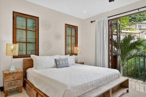 Ένα ή περισσότερα κρεβάτια σε δωμάτιο στο Plaza Carlota 22 At Las Catalinas