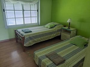 En eller flere senge i et værelse på Casa Quinta Las Palmeras + 7 billeder