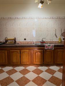 a kitchen with a sink and a counter top at Samadis Home in Larache +9 photos
