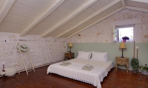 Ένα ή περισσότερα κρεβάτια σε δωμάτιο στο Villa Aurora +9 φωτογραφίες