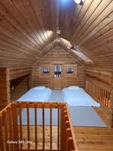 Ένα ή περισσότερα κρεβάτια σε δωμάτιο στο Carrot Log