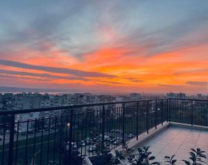 a view of a sunset from a balcony at Vyara apartments 56 in Varna City