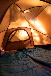 Postel nebo postele na pokoji v ubytování FITZ CAMP - Glamping agreste - Base Cerro Fitz Roy