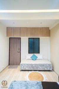 Ένα ή περισσότερα κρεβάτια σε δωμάτιο στο Desai Home Stay