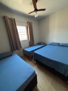 Ένα ή περισσότερα κρεβάτια σε δωμάτιο στο Recanto Lemes