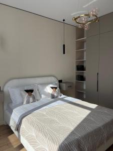 Postel nebo postele na pokoji v ubytování Luxury Apartment in Buqar Jyrau + 10 fotografií