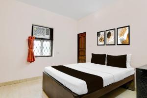 Postel nebo postele na pokoji v ubytování Super Hotel O City Of Joy + 22 fotografií