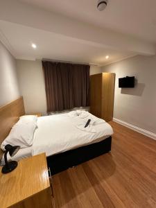 Postel nebo postele na pokoji v ubytování Cavendish Hotel + 8 fotografií