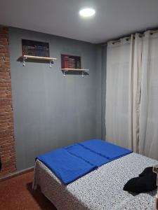 Postel nebo postele na pokoji v ubytování Nueva 5