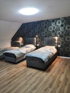 Postel nebo postele na pokoji v ubytování Pension bei Laura