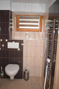 Koupelna v ubytování Pohodový domek + 9 fotografií