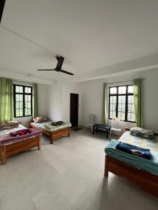 Postel nebo postele na pokoji v ubytování Hornbill Homes 1