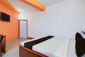 Voodi või voodid majutusasutuse Hotel O Swami Vivekananda University Kolkata toas