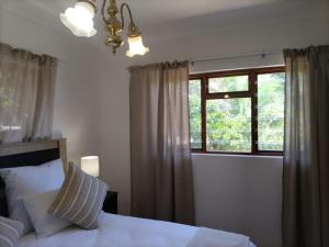 Postel nebo postele na pokoji v ubytování The Garden House