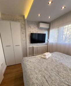 Ένα ή περισσότερα κρεβάτια σε δωμάτιο στο Apartmani Classic NP