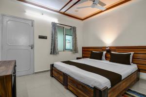 Ένα ή περισσότερα κρεβάτια σε δωμάτιο στο Hotel O Galaxy Inn