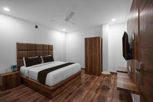 Ένα ή περισσότερα κρεβάτια σε δωμάτιο στο Hotel O THE ERA INFINITY HOTEL