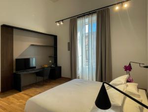 Ένα ή περισσότερα κρεβάτια σε δωμάτιο στο Tambasia