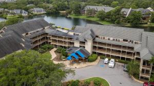 an aerial view of a hotel with a lake at Kingston Plantation - Laurel Court #112 - Seaclusion in Myrtle Beach