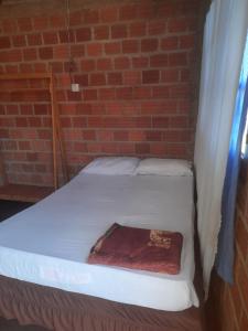 Ένα ή περισσότερα κρεβάτια σε δωμάτιο στο Iguazú Garden