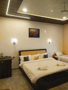 Ένα ή περισσότερα κρεβάτια σε δωμάτιο στο Tiger Home Stay Resort