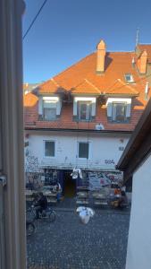 a building with graffiti on the side of it at Cozy apartments in Ljubljana