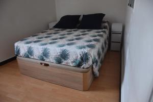 a bed in a small room with at La Maison des Trois in Beausoleil