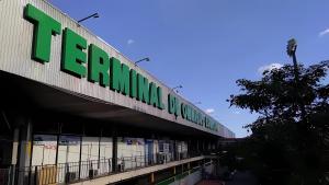 a building with a green sign on the side of it at Miraflores 1- The greenhouse in Asunción