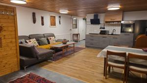 a living room with a couch and a table at Nordlicht in Schortens