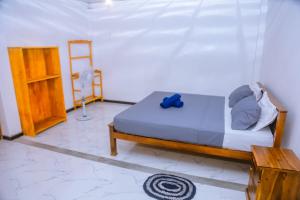 Postel nebo postele na pokoji v ubytování Good Home Mirissa