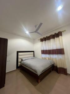 Giường trong phòng chung tại Fxy apartment