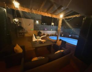 an overhead view of a living room with a swimming pool at Dar Nur Villa Private pool, Barbecue and Solarium in La Oliva