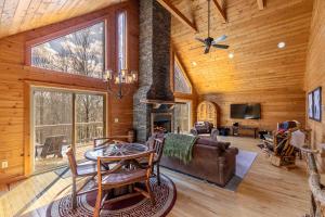 a living room with a fireplace in a log cabin at Whiskey Bear Escape in Fleetwood
