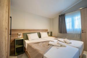 Giường trong phòng chung tại Casa Domenica Luxury Villas +36 ảnh