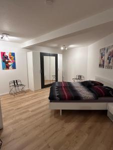 Ένα ή περισσότερα κρεβάτια σε δωμάτιο στο Komfort Domizil Erfurt